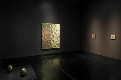Works by Lucio Fontana, Yves Klein and Robert Rauschenberg join Byzantine icons in this dark, theatrically lit room. Photo courtesy of the Menil Collection.